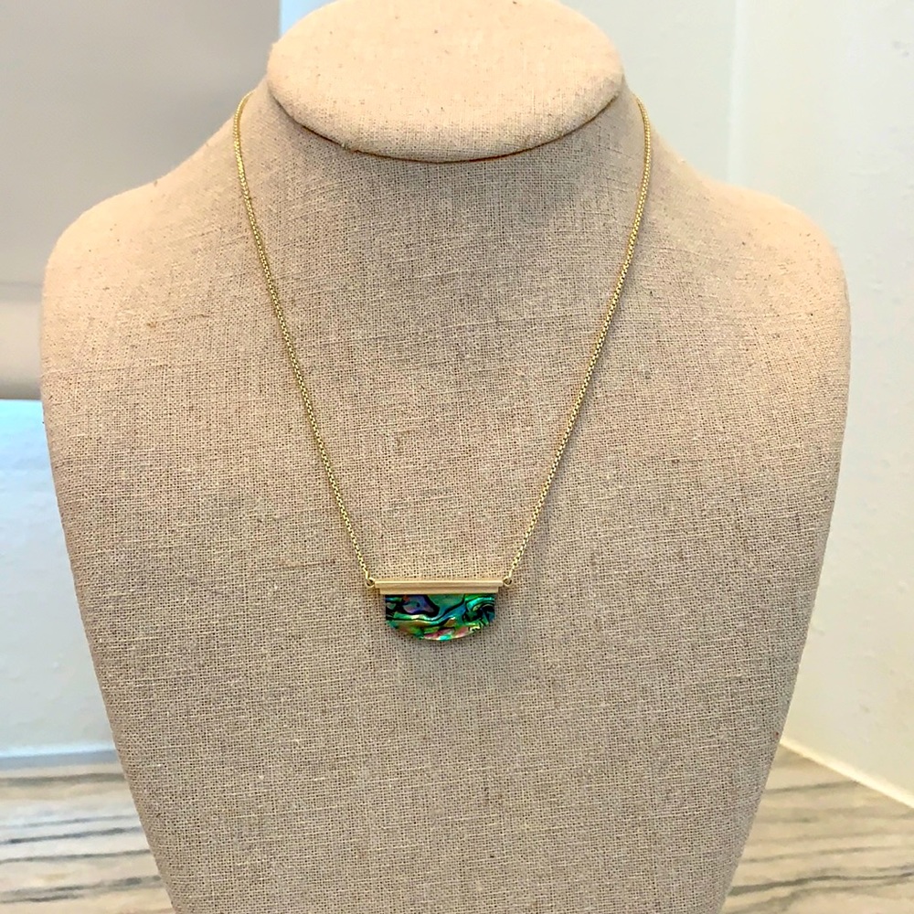 Kendra Scott black mother of Pearl necklace.